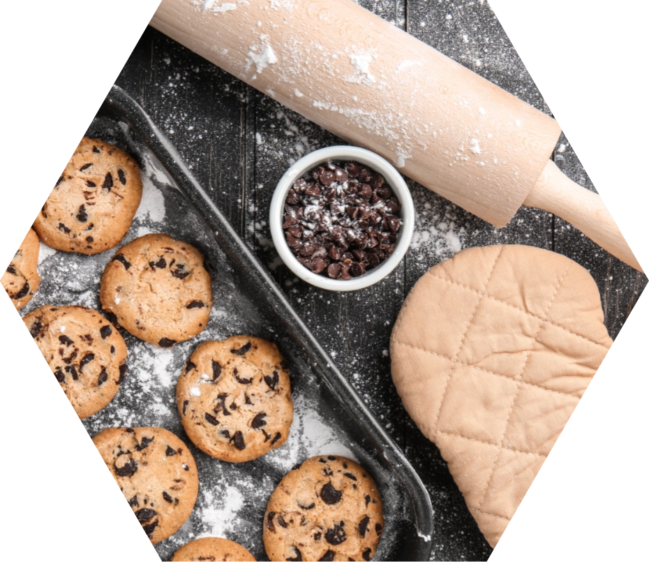 Tasty cookies with chocolate chips on wooden table-1@2x